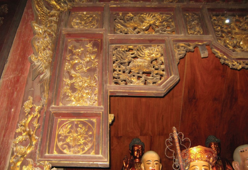 Long m&atilde; tr&ecirc;n cửa v&otilde;ng ch&ugrave;a Thầy (H&agrave; Nội) - Ảnh: Sưu tầm